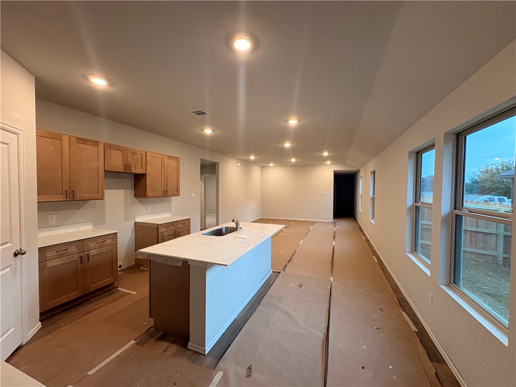 2305 White Wing Navasota, TX 77868 - Photo 3 of 7 a large kitchen with kitchen island a sink stainless steel appliances and cabinets