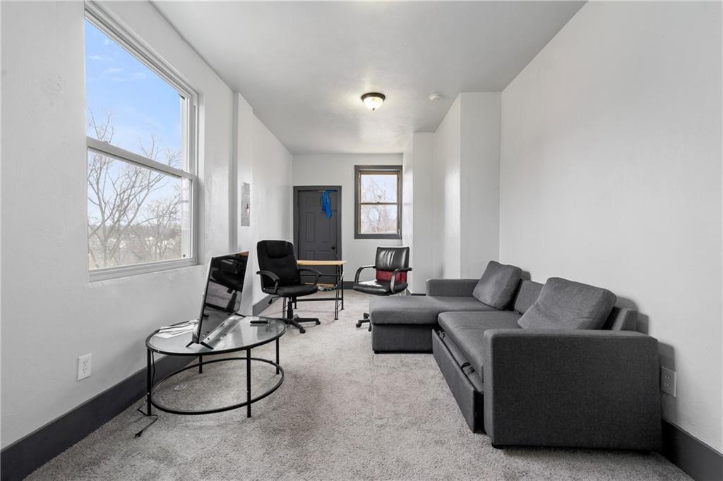1306 Complete Street Pittsburgh, PA 15212 - Photo 13 of 24 a living room with furniture and a window