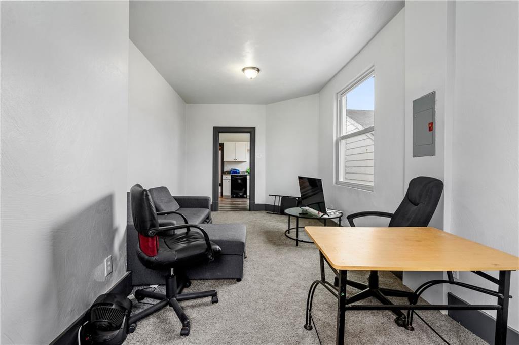 1306 Complete Street Pittsburgh, PA 15212 - Photo 14 of 24 a view of a workspace with furniture and a window