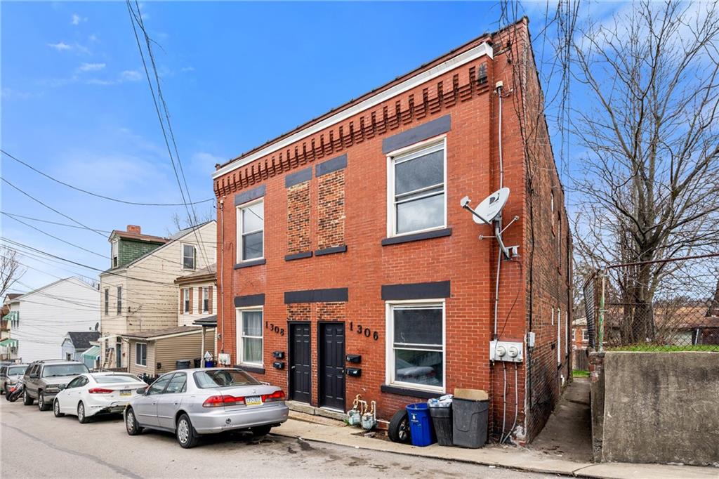 1306 Complete Street Pittsburgh, PA 15212 - Photo 2 of 24 a view of a car park in front of house