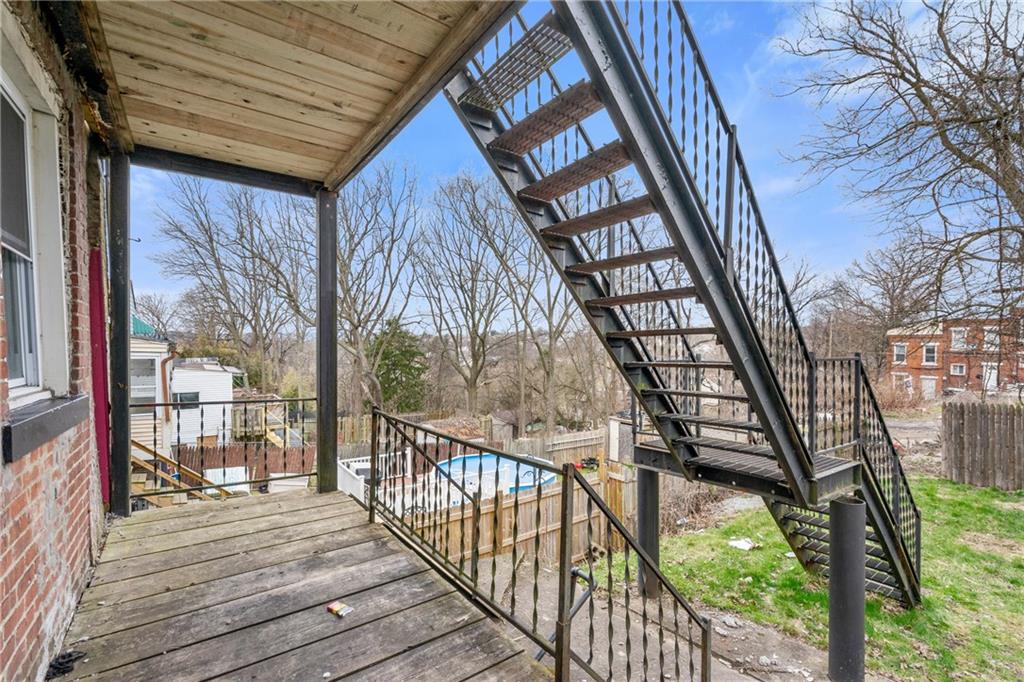 1306 Complete Street Pittsburgh, PA 15212 - Photo 22 of 24 a balcony with wooden floor and furniture