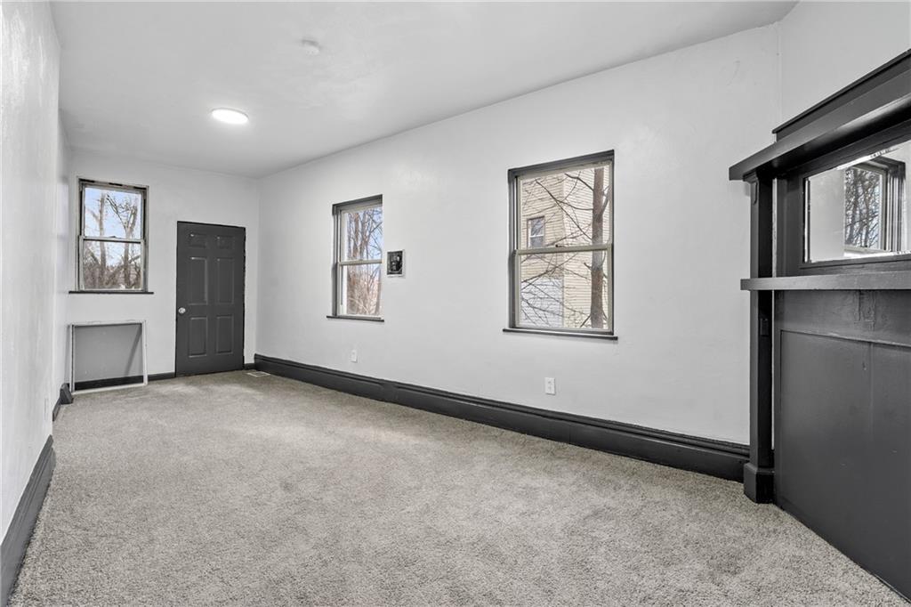1306 Complete Street Pittsburgh, PA 15212 - Photo 8 of 24 a view of an empty room with windows