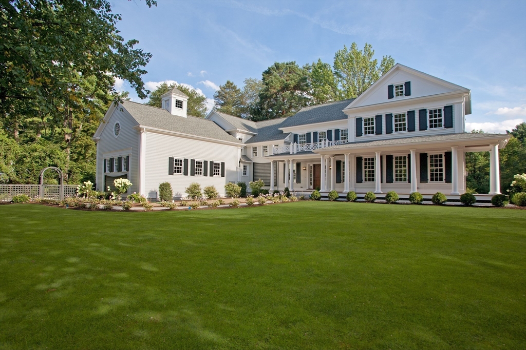 315 Musketaquid Road Concord, MA 01742 - Photo 1 of 41 a front view of a house with a garden