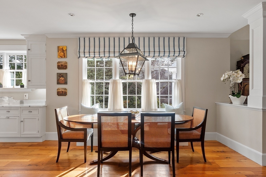 315 Musketaquid Road Concord, MA 01742 - Photo 14 of 41 a dining room with furniture a chandelier and wooden floor