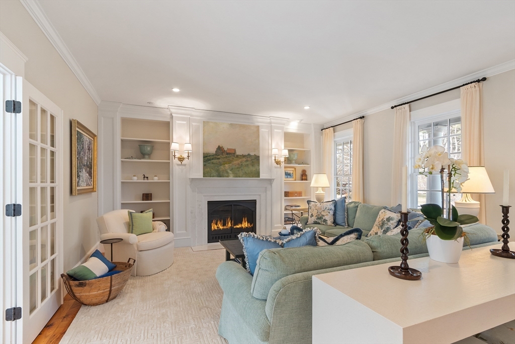 315 Musketaquid Road Concord, MA 01742 - Photo 17 of 41 a living room with furniture and a fireplace