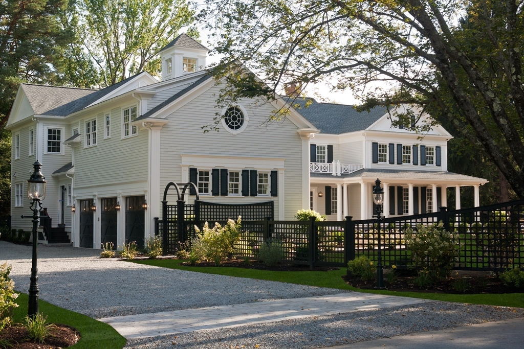 315 Musketaquid Road Concord, MA 01742 - Photo 2 of 41 a front view of a house with a garden