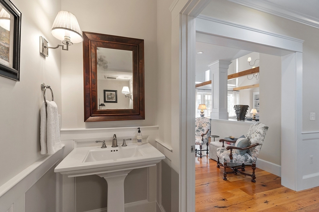 315 Musketaquid Road Concord, MA 01742 - Photo 21 of 41 a en suite bathroom with a toilet sink and mirror