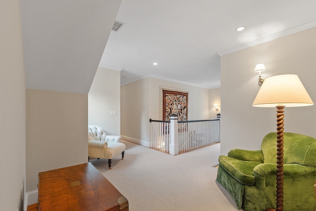 315 Musketaquid Road Concord, MA 01742 - Photo 24 of 41 a living room with furniture and a table