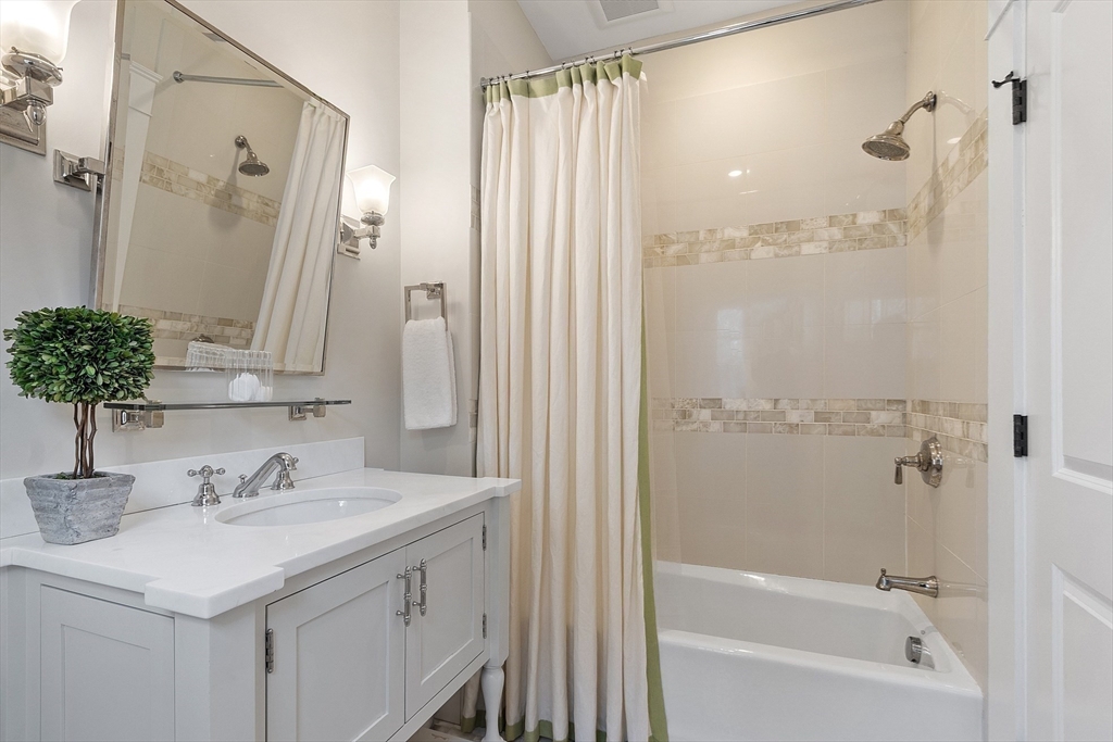315 Musketaquid Road Concord, MA 01742 - Photo 30 of 41 a bathroom with a sink and a mirror