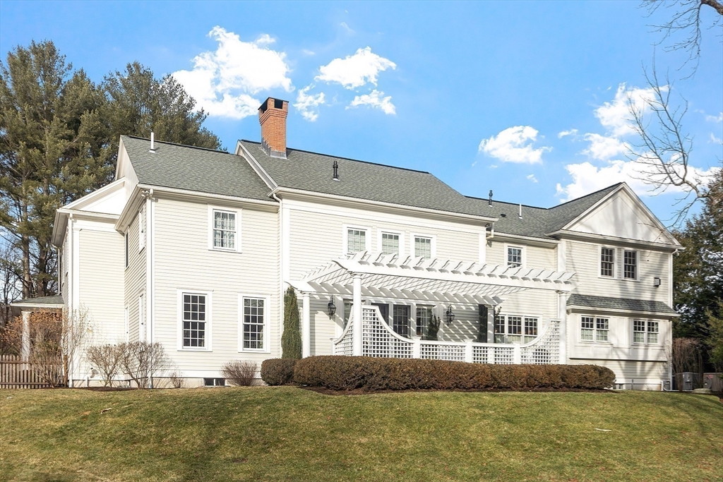 315 Musketaquid Road Concord, MA 01742 - Photo 34 of 41 a front view of a house with a yard