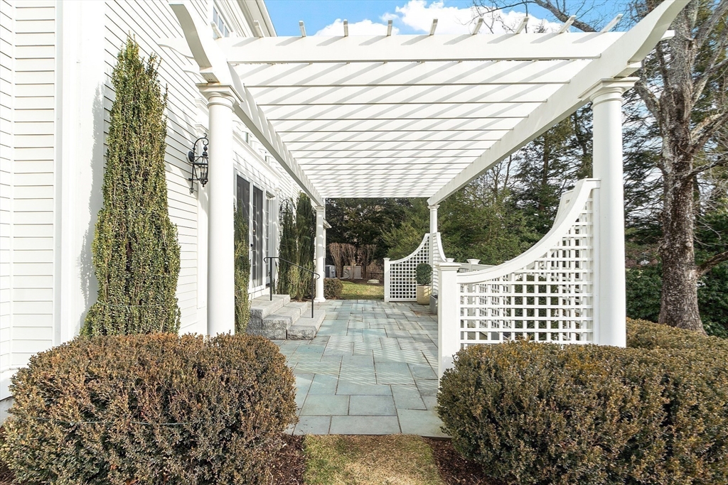 315 Musketaquid Road Concord, MA 01742 - Photo 35 of 41 a view of a patio with a chairs and table in the patio