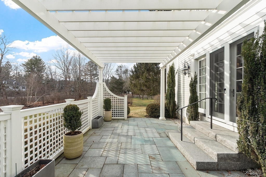 315 Musketaquid Road Concord, MA 01742 - Photo 36 of 41 a porch with seating space