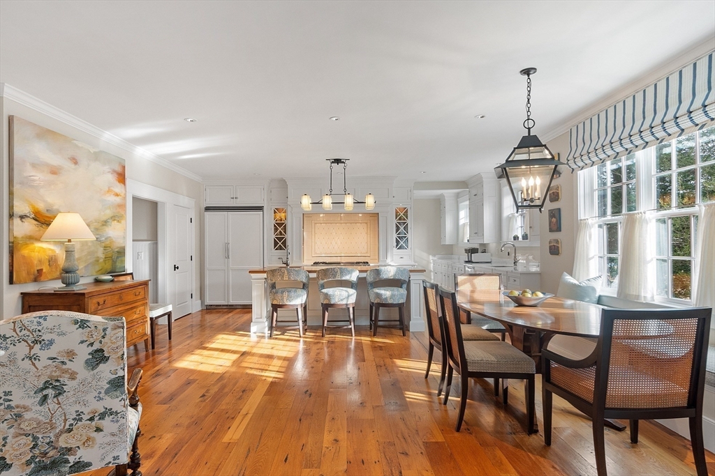 315 Musketaquid Road Concord, MA 01742 - Photo 9 of 41 a view of a dining room with furniture window and wooden floor