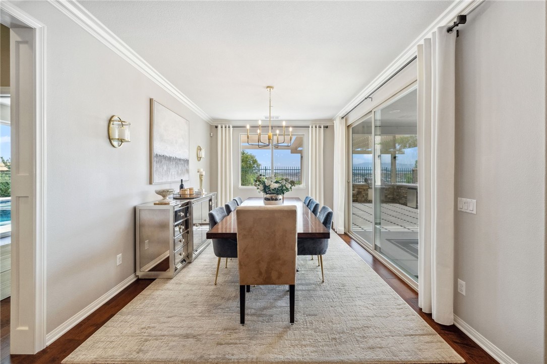 39148 Steeplechase Lane Temecula, CA 92591 - Photo 17 of 65 a view of a dining room with furniture window and wooden floor