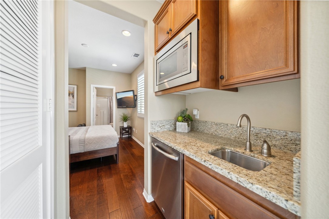 39148 Steeplechase Lane Temecula, CA 92591 - Photo 19 of 65 a kitchen with stainless steel appliances granite countertop a sink and cabinets