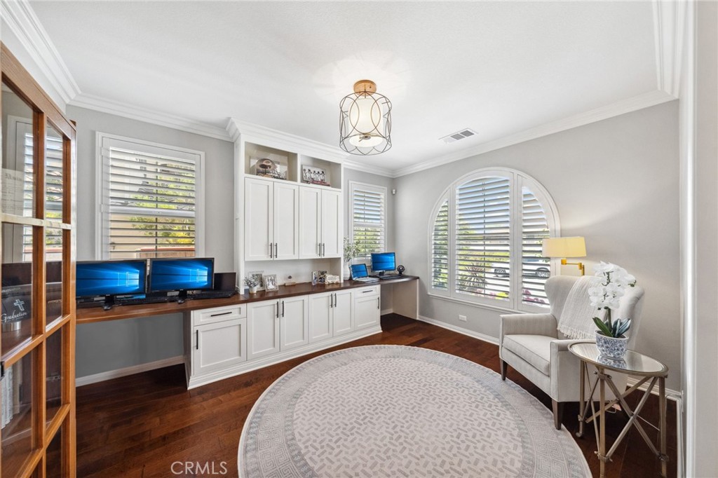 39148 Steeplechase Lane Temecula, CA 92591 - Photo 22 of 65 a kitchen with stainless steel appliances a stove a sink and white cabinets