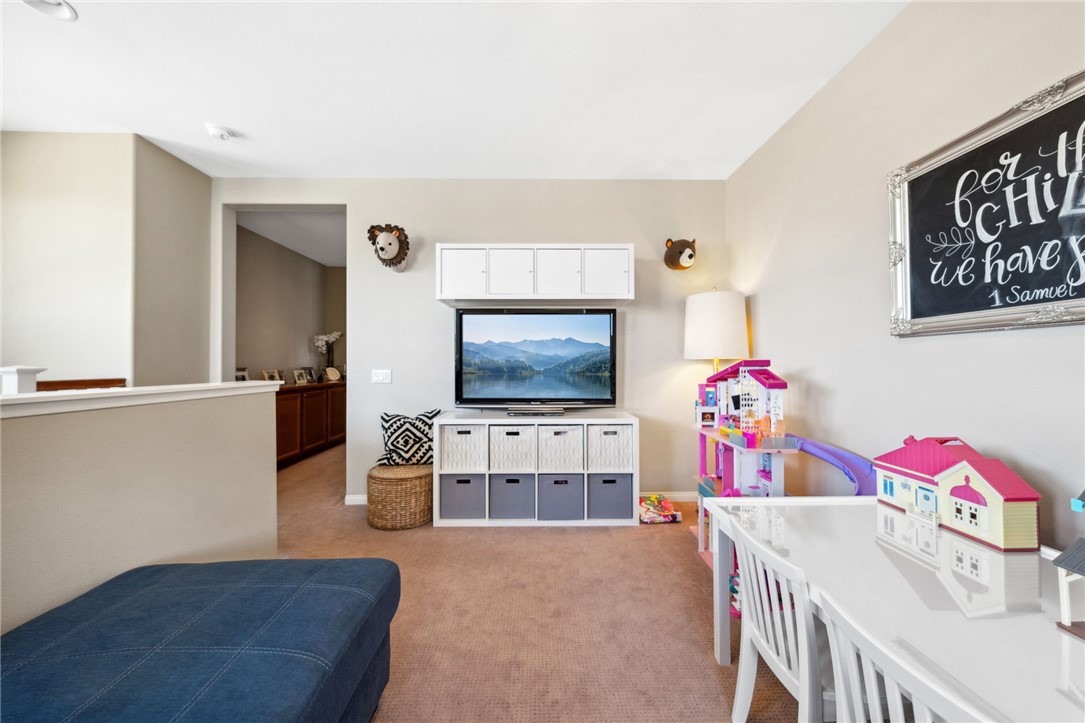 39148 Steeplechase Lane Temecula, CA 92591 - Photo 25 of 65 a living room with furniture and flat screen tv