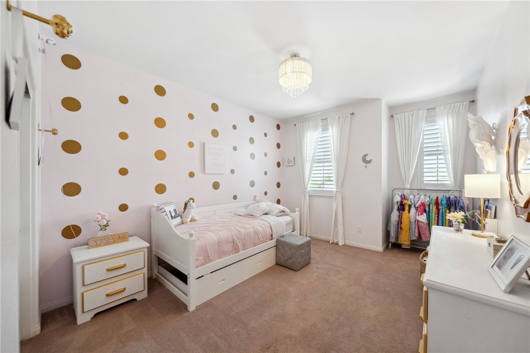 39148 Steeplechase Lane Temecula, CA 92591 - Photo 27 of 65 a bedroom with bed and a large mirror