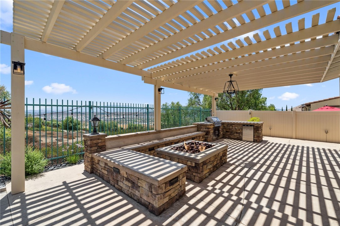 39148 Steeplechase Lane Temecula, CA 92591 - Photo 40 of 65 a view of a patio with a table and chairs