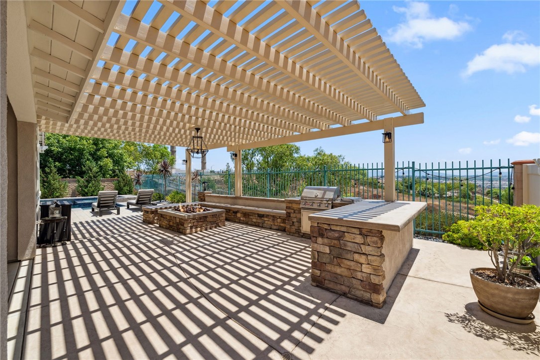 39148 Steeplechase Lane Temecula, CA 92591 - Photo 43 of 65 a view of a patio with a table and chairs