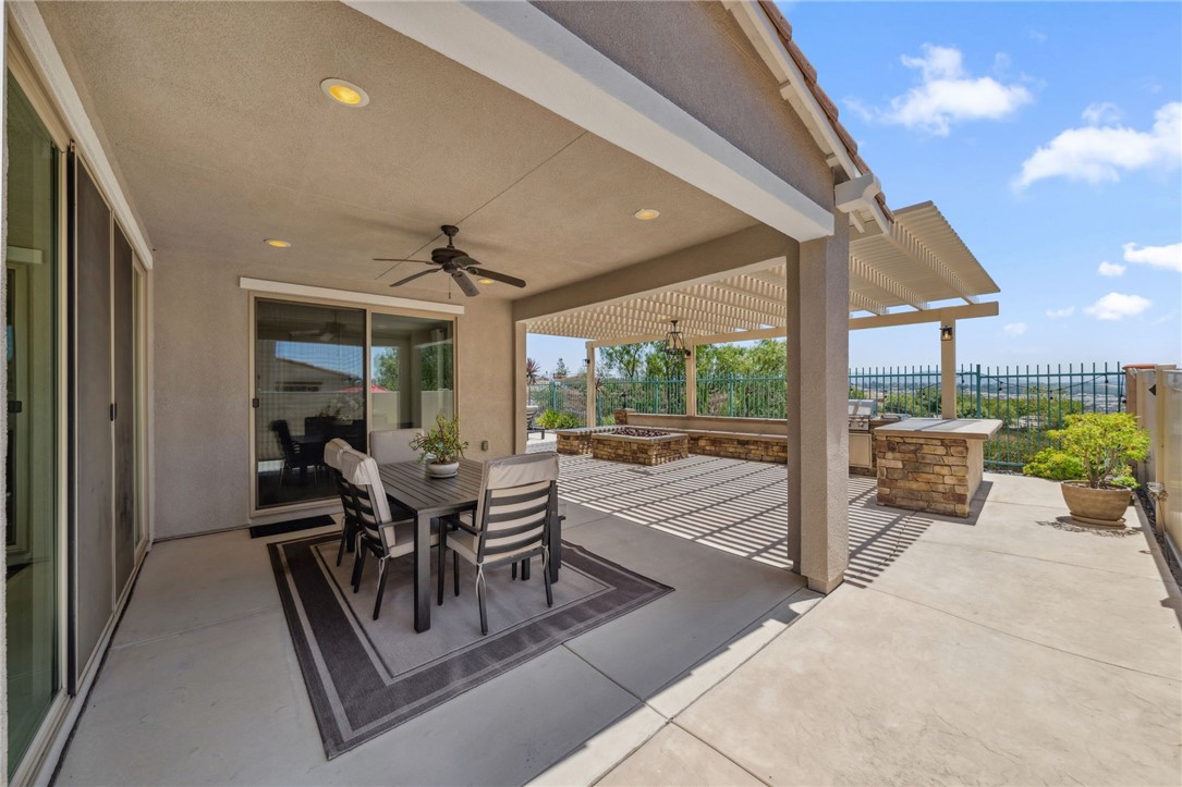 39148 Steeplechase Lane Temecula, CA 92591 - Photo 45 of 65 a dining room with furniture and a floor to ceiling window