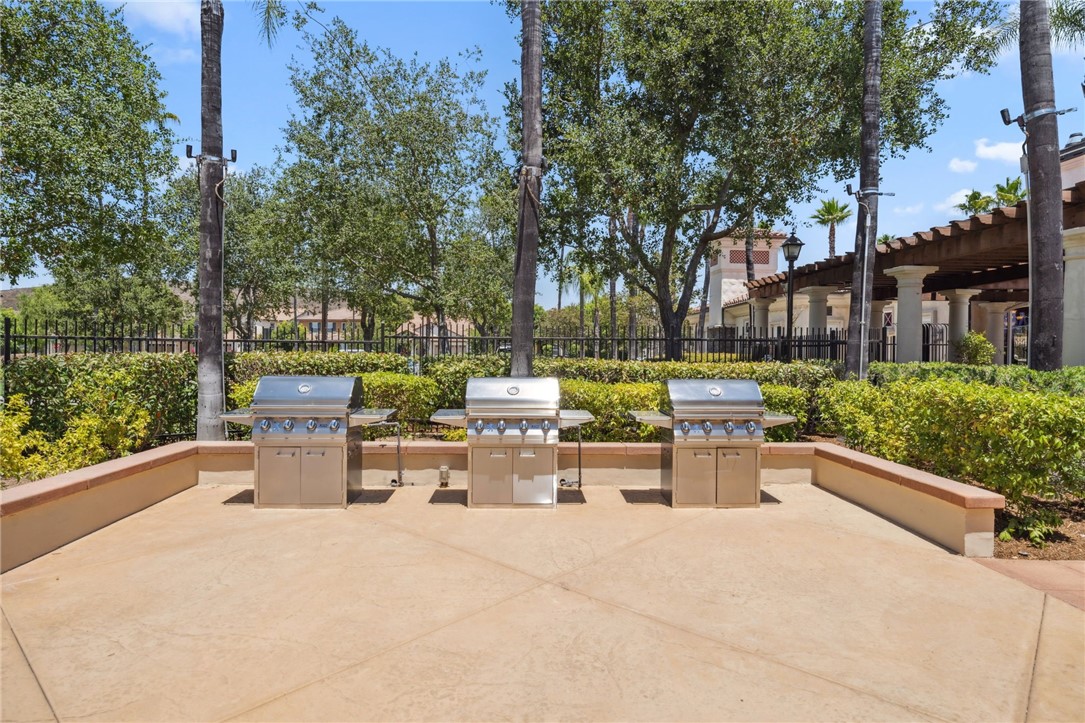 39148 Steeplechase Lane Temecula, CA 92591 - Photo 59 of 65 a view of a patio with couches and table and chairs and potted plants