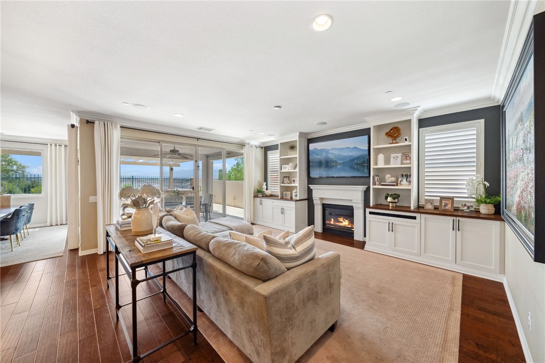 39148 Steeplechase Lane Temecula, CA 92591 - Photo 8 of 65 a living room with fireplace furniture and a large window