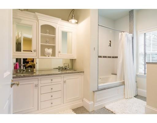 26 Tyler Road Lexington, MA 02420 - Photo 15 of 29 a bathroom with a tub sink and mirror