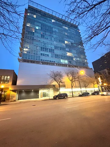 a view of a building with a street