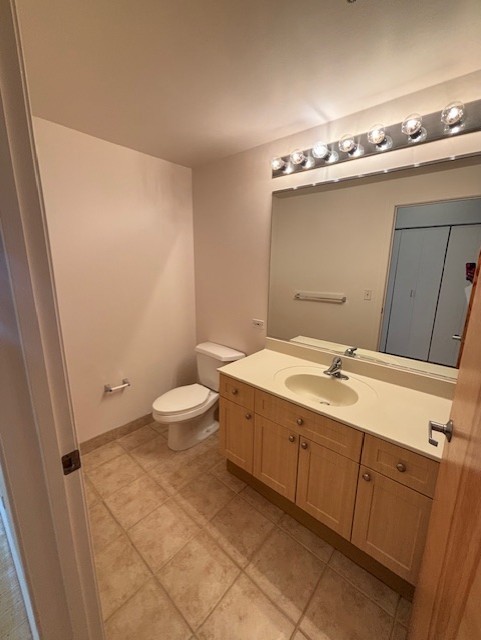 1845 South Michigan Avenue, Unit 1810 Chicago, IL 60616 - Photo 14 of 16 a bathroom with a sink a toilet and mirror