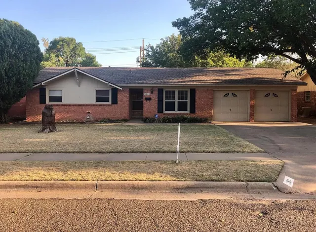 a house view with a garden space