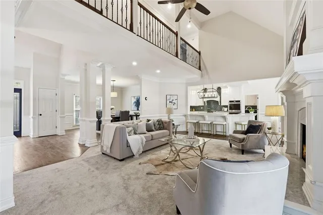 a living room with furniture and a fireplace
