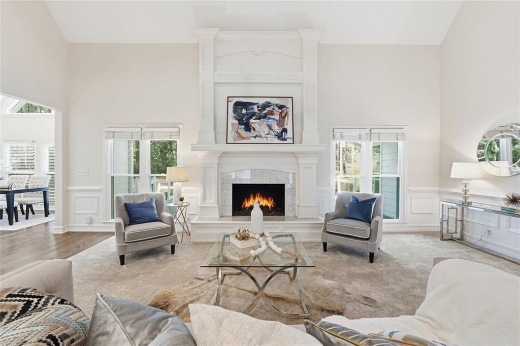 1520 Natchez Way Grayson, GA 30017 - Photo 12 of 63 a living room with furniture and a fireplace