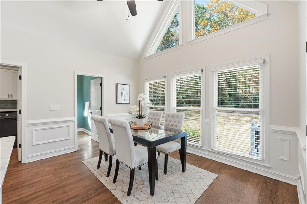 1520 Natchez Way Grayson, GA 30017 - Photo 13 of 63 a view of a dining room with furniture and wooden floor