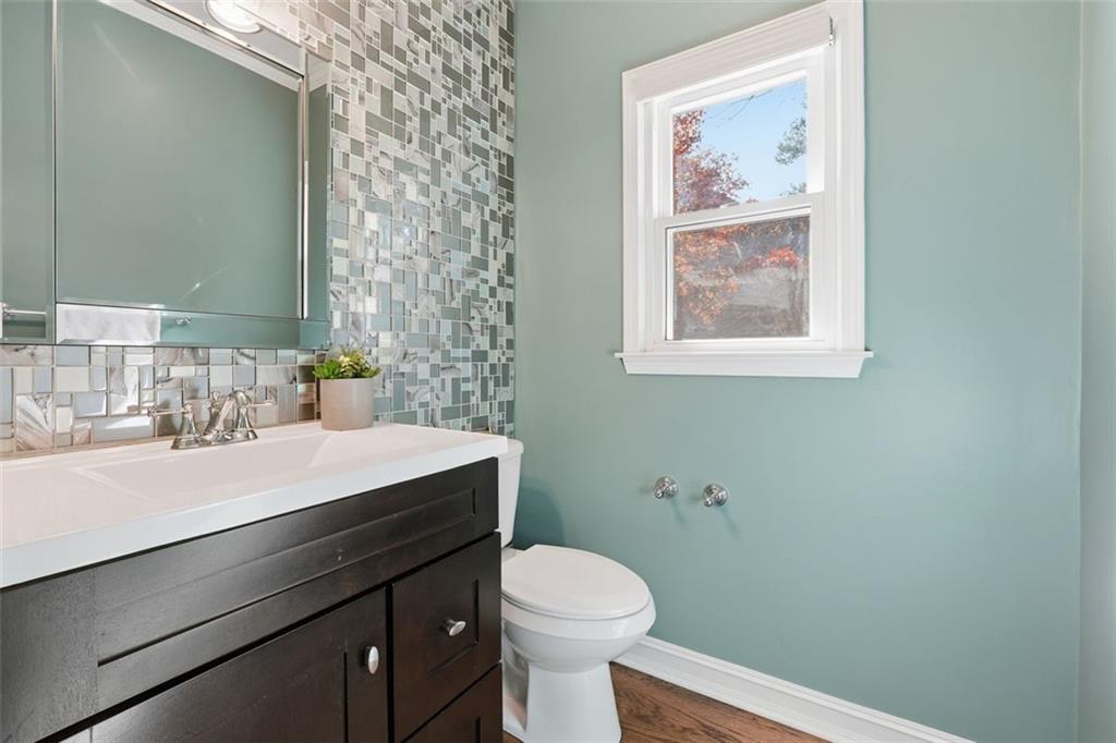 1520 Natchez Way Grayson, GA 30017 - Photo 24 of 63 a bathroom with a sink a toilet and mirror