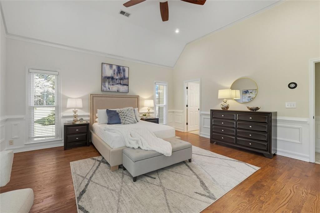 1520 Natchez Way Grayson, GA 30017 - Photo 26 of 63 a bedroom with a bed and wooden floor