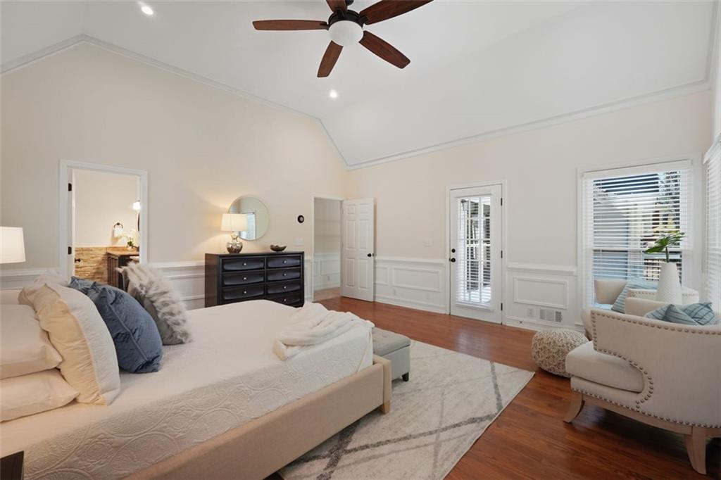 1520 Natchez Way Grayson, GA 30017 - Photo 27 of 63 a large bedroom with a bed and furniture