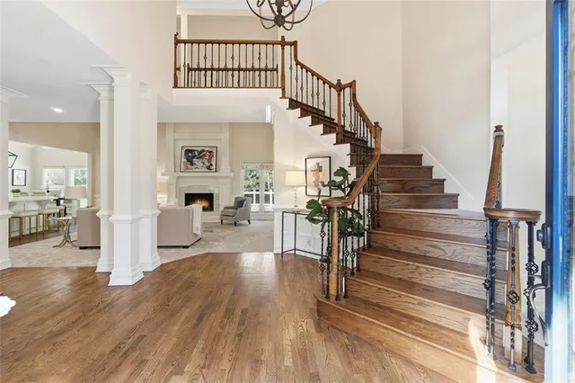 a view of entryway and hall with wooden floor