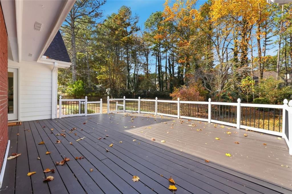 1520 Natchez Way Grayson, GA 30017 - Photo 44 of 63 a view of a wooden deck with a bench
