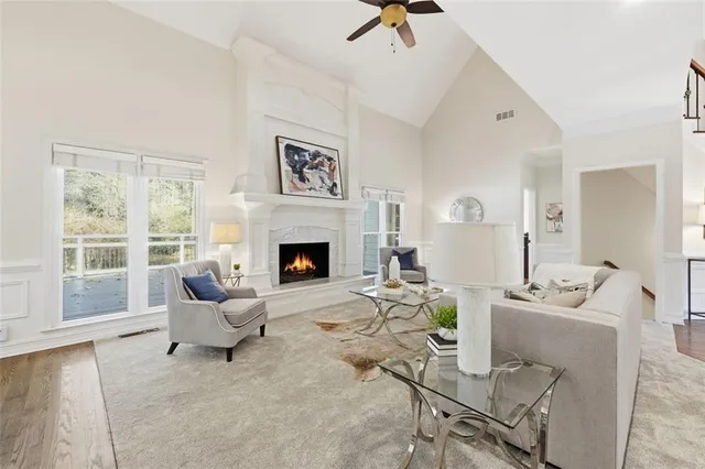 a living room with fireplace furniture and a view of living room