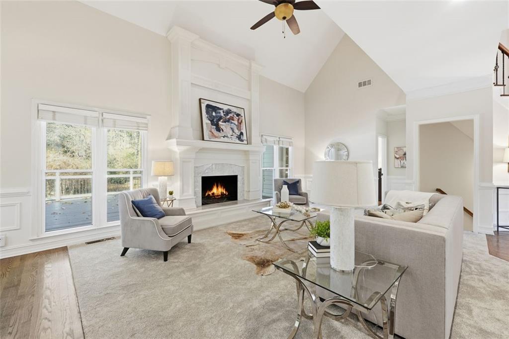 1520 Natchez Way Grayson, GA 30017 - Photo 10 of 63 a living room with furniture and a fireplace