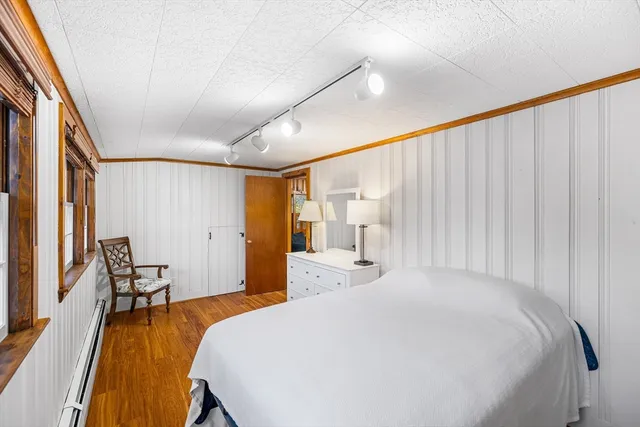 a bedroom with a bed and a couch