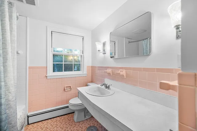 a bedroom with a workspace