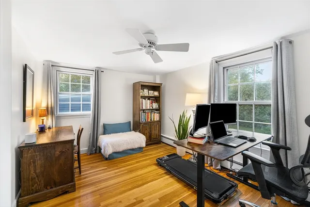 a spacious bedroom with a bed and a window