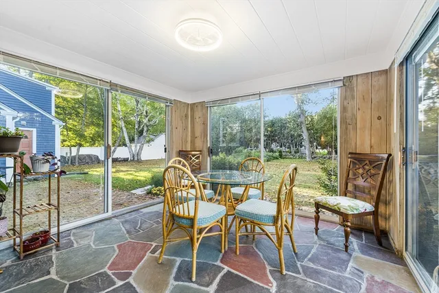 a view of entryway with wooden floor and stairs