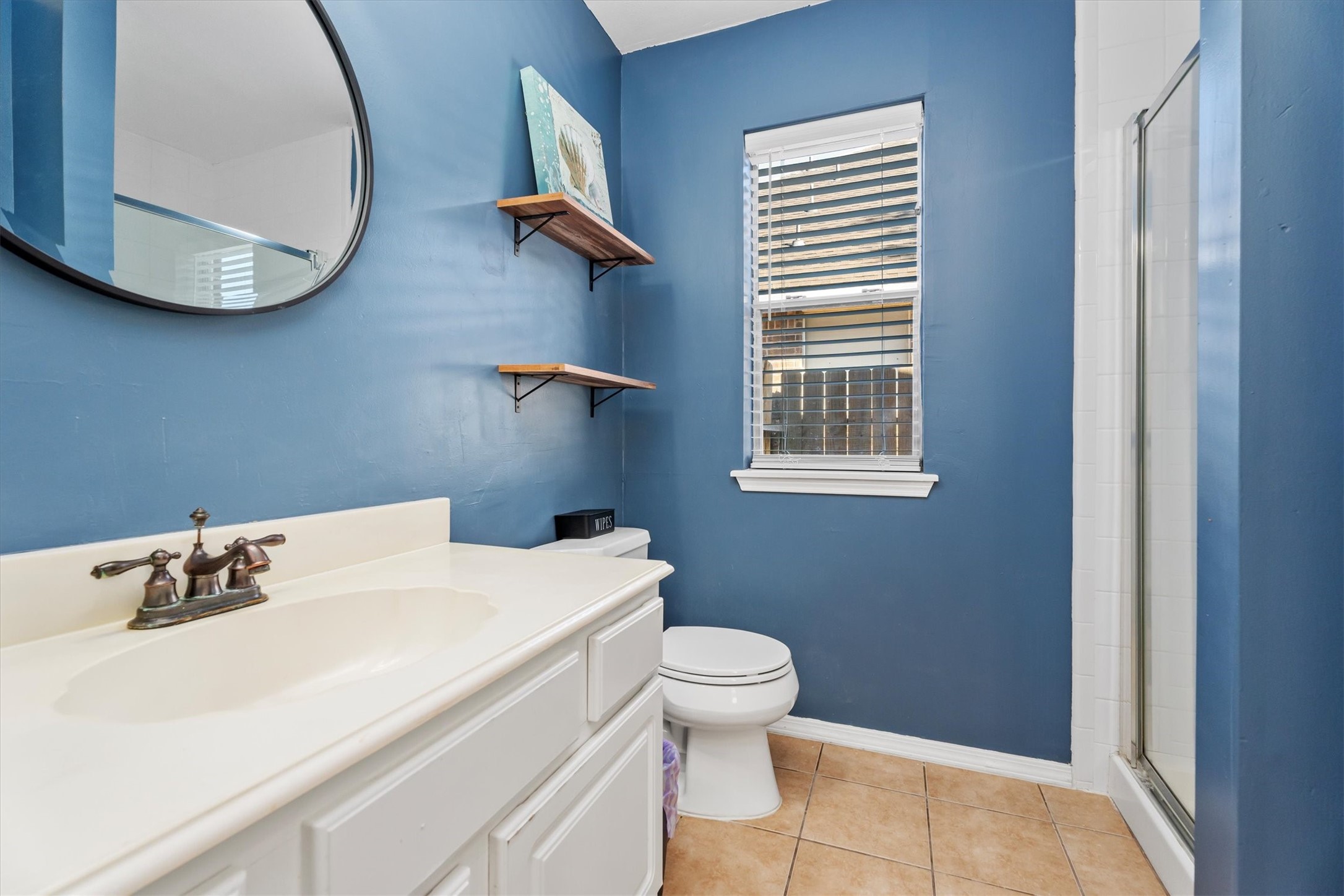 3315 La Seine Lane Spring, TX 77388 - Photo 18 of 30 a bathroom with a sink a toilet and a mirror
