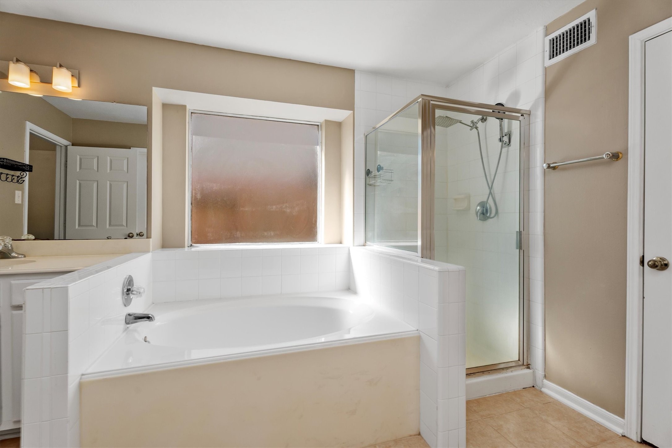 3315 La Seine Lane Spring, TX 77388 - Photo 21 of 30 a bathroom with a bathtub and a shower