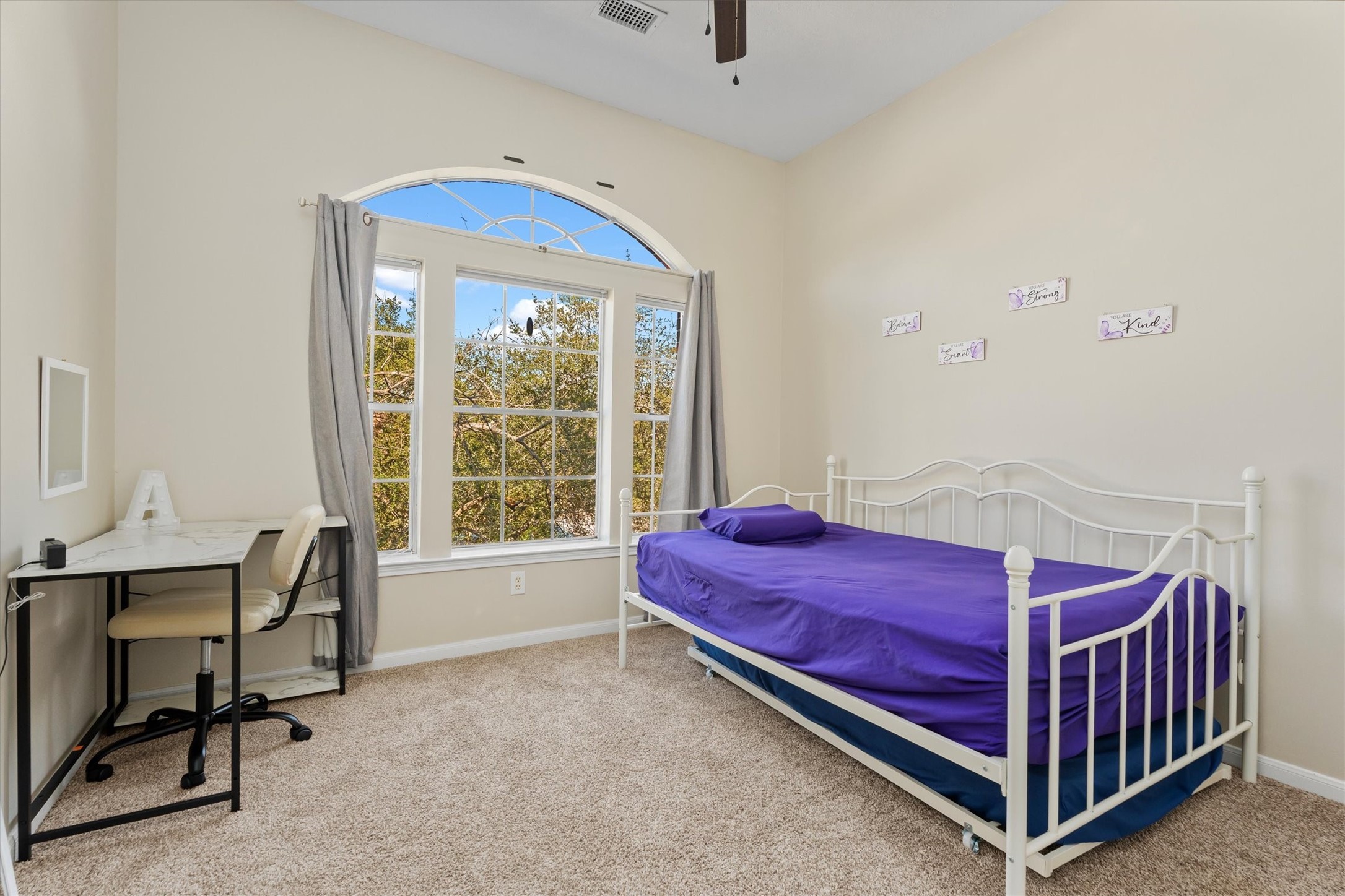 3315 La Seine Lane Spring, TX 77388 - Photo 24 of 30 a bedroom with a bed and a table