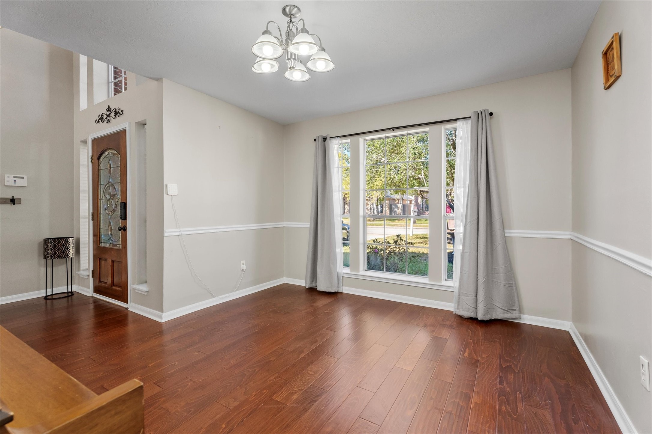 3315 La Seine Lane Spring, TX 77388 - Photo 10 of 30 an empty room with wooden floor and windows