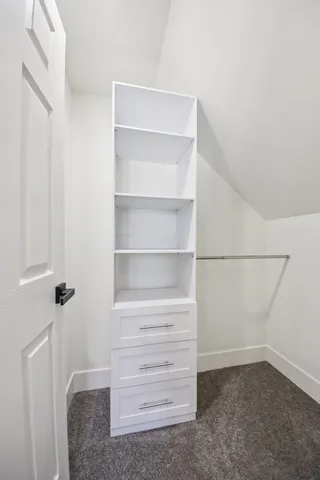 a view of an empty walk in closet